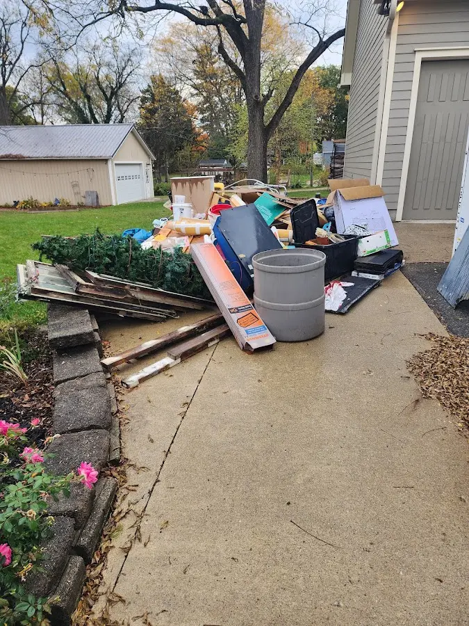 Dumpster being loaded with debris for 12 Yard Dumpster Rental in Strasburg